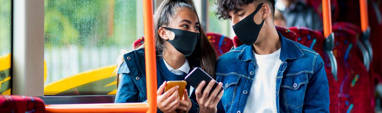 passengers on bus wearing masks